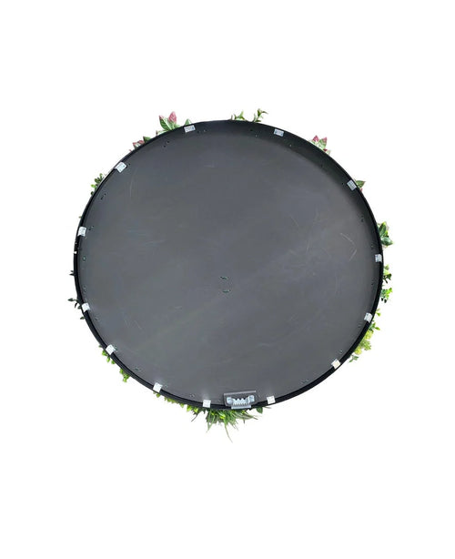 Eine künstliche Hecke auf einem Trampolin mit schwarzem Rahmen, Ø 100 cm, von oben gesehen mit grünen Blättern und rosa Blüten am Rand, vor einem weißen Hintergrund.