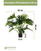 Kunstpflanze Philodendron UV 90 cm im schwarzen Topf, mit 90 cm breiten Blättern. Perfekt für jeden Raum. Topfgröße: 12 cm hoch, 13 cm breit. Easyplants-Logo unten.